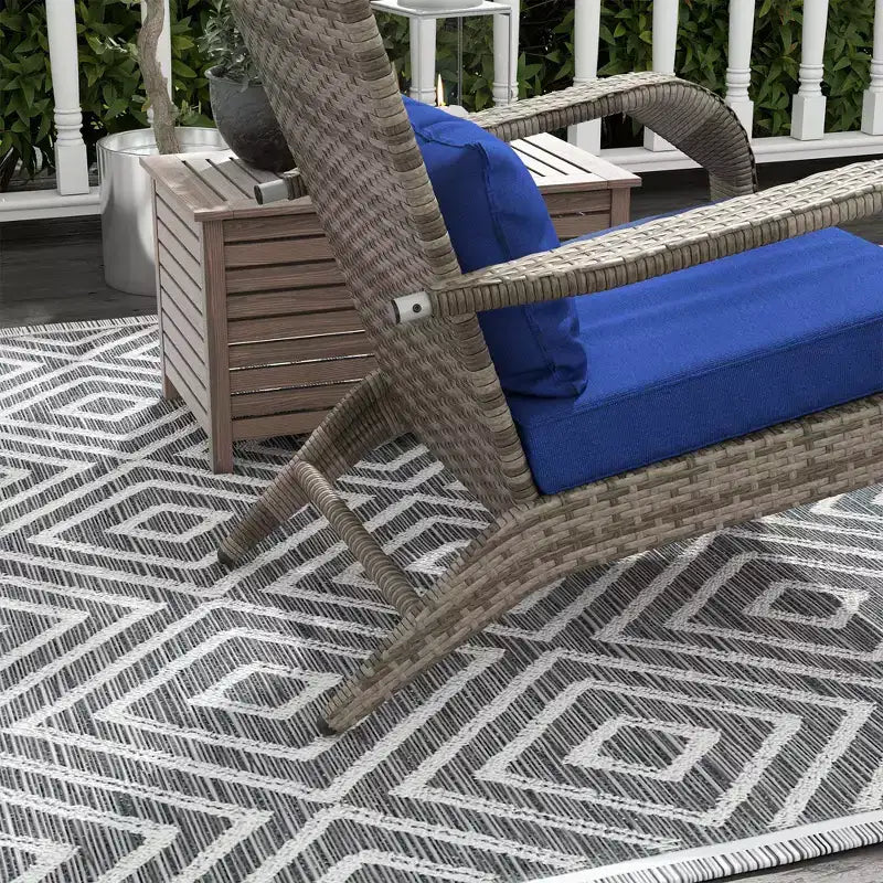 Sedia Adirondack in vimini per braciere con pouf e cuscini