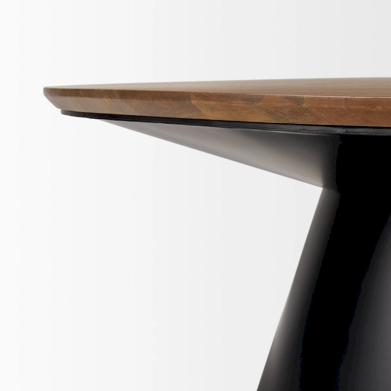Tavolino rotondo Mitchell con piano in legno massello e base in ghisa nera