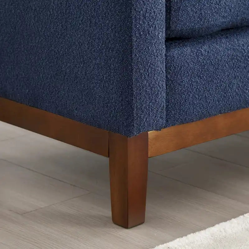 Panca imbottita con gambe in legno